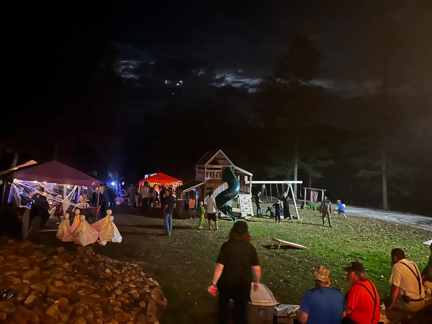 Guests enjoying a community event after dark